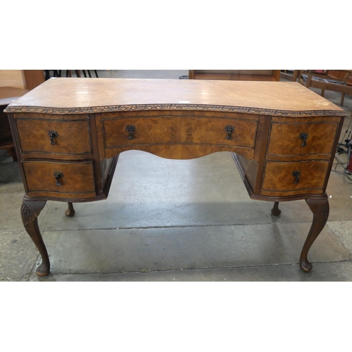 81 - A Queen Anne style burr walnut desk