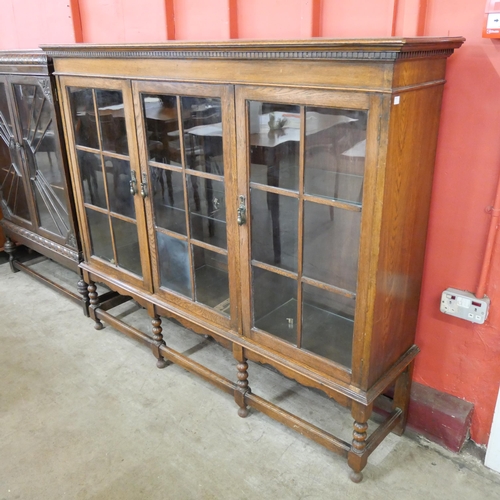 86 - An early 20th Century oak three door bookcase