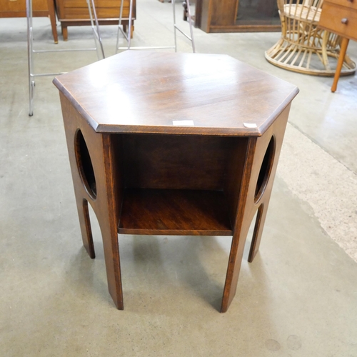 93 - An Arts and Crafts Liberty & Co. oak hexagonal table