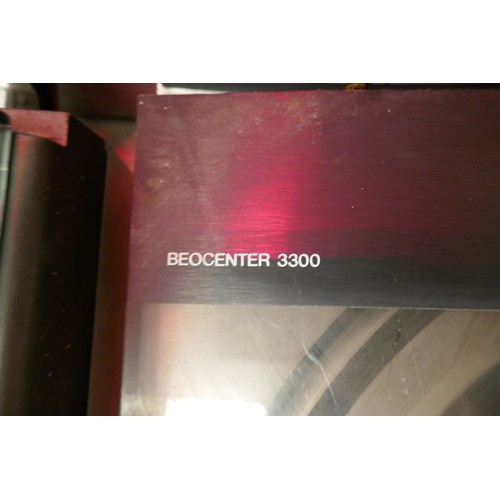 2185 - A Bang & Olufsen Beocenter 3300 AM/FM stereo receiver with an automatic turntable record player