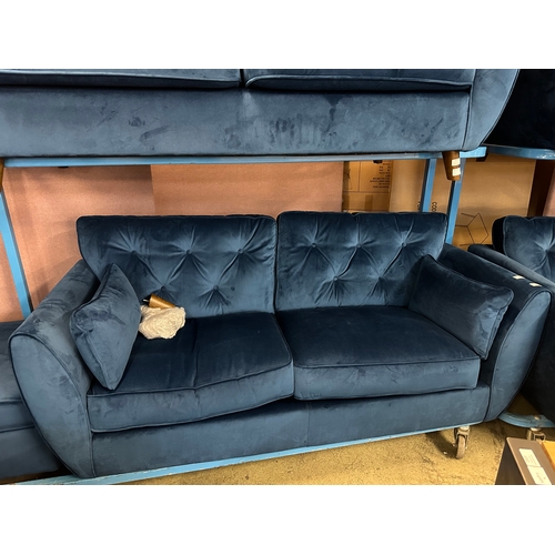 1558 - A Hoxton blue velvet upholstered three seater sofa and footstool, RRP £799