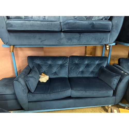 1558 - A Hoxton blue velvet upholstered three seater sofa and footstool, RRP £799