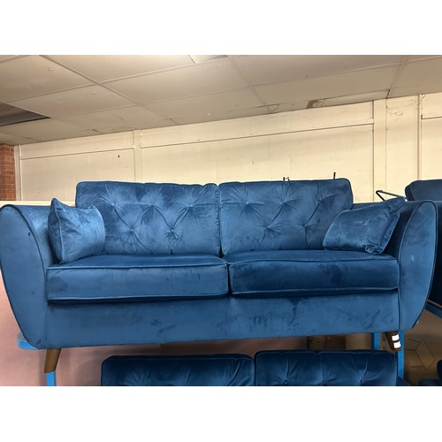 1557 - A Hoxton blue velvet upholstered three seater sofa