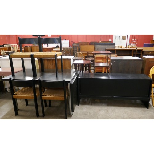 192 - A Scandinavian black ash dining suite, comprising;  extending dining table, four chairs and a sidebo... 