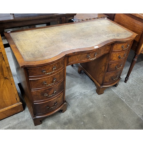 65 - A George III style mahogany and green leather topped Bevan Funnell desk