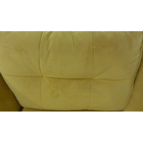1354 - A turmeric velvet two seater sofa