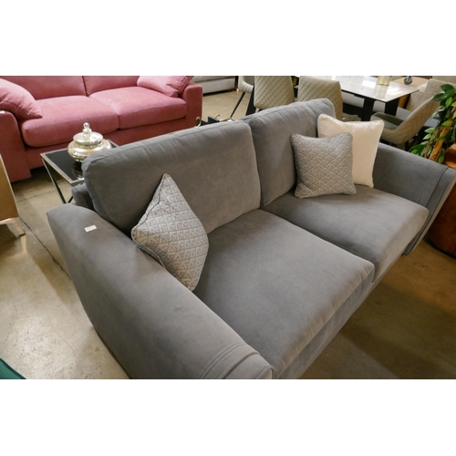 1355 - A steel blue three seater sofa and contrasting off white three seater sofa