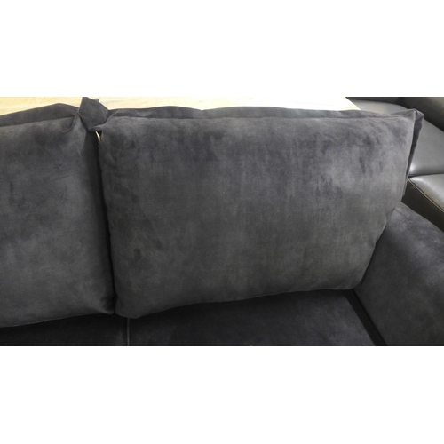 1359 - A Kingsley black velvet three seater sofa on metal legs