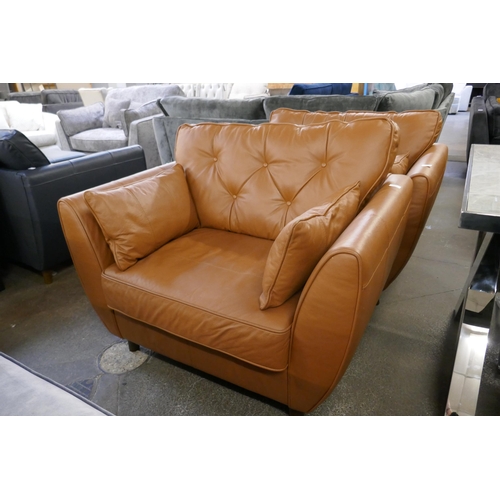 1387 - A tan leather Hoxton love seat, RRP £1539