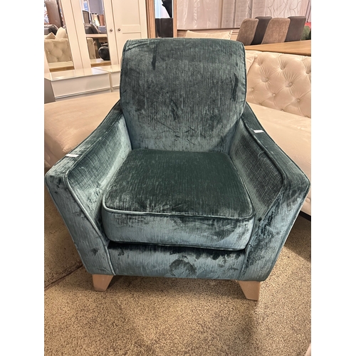 1390 - An emerald velvet upholstered armchair