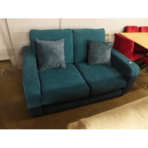 1421 - A turquoise corded two seater sofa