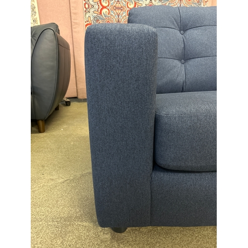 1491 - A dark blue upholstered 2.5 seater sofa
