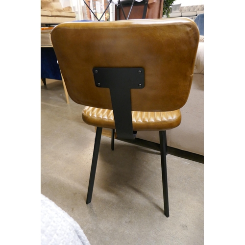 1395 - A light brown leather chair
