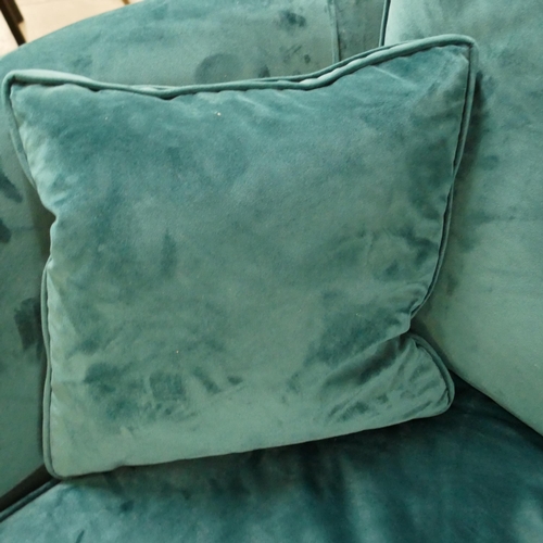 1398 - A turquoise velvet swivel love seat