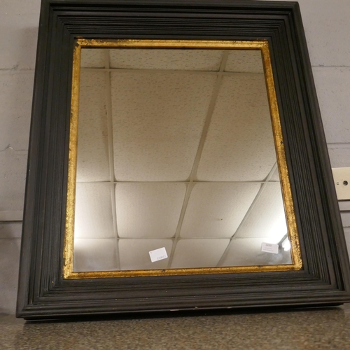 1499 - A black and gold framed mirror