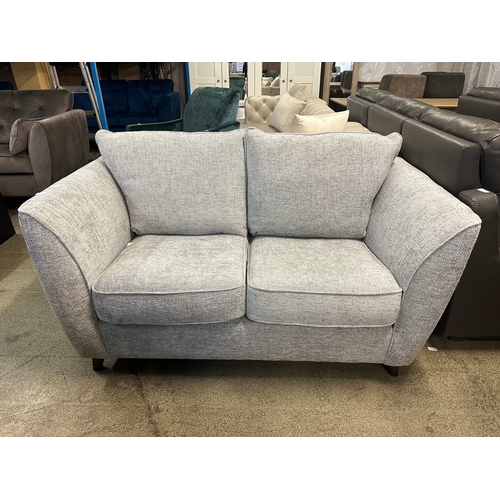 1531 - A grey textured weave upholstered two seater sofa
