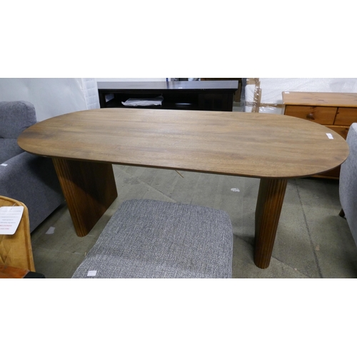 1533 - A mango wood dining table , nail protruding through table top * This lot is subject to vat