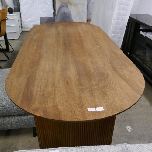 1533 - A mango wood dining table , nail protruding through table top * This lot is subject to vat