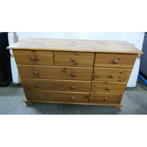 1547 - A pine chest of nine drawers * this lot is subject to VAT