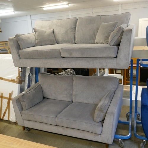 1552 - A pair of Barker and Stonehouse Rene Grey upholstered three seater sofas, some minor damage and mark... 