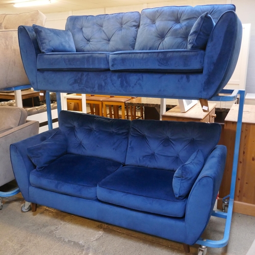 1553 - A pair of blue Hoxton velvet sofas - damaged