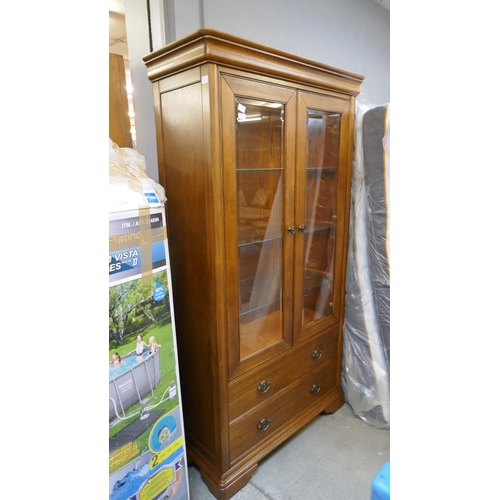 1561 - An oak two door, two drawer glazed display cabinet