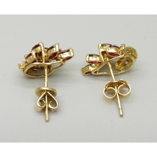 1003 - A pair of 18ct gold, ruby and diamond earrings, (odd fasteners, one marked 750), 3.2g