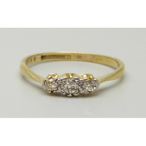 1014 - An 18ct gold and platinum set three stone diamond ring, 2.1g, P