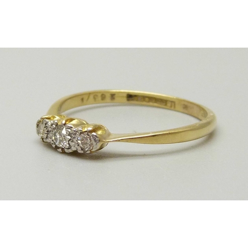 1014 - An 18ct gold and platinum set three stone diamond ring, 2.1g, P