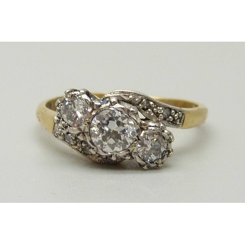 1015 - An 18ct gold and diamond ring, approximately 0.60ct diamond weight, 3.2g, M