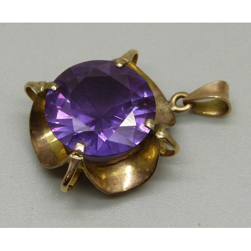 1022 - A 9ct gold, amethyst colour gem set pendant, 5.4g