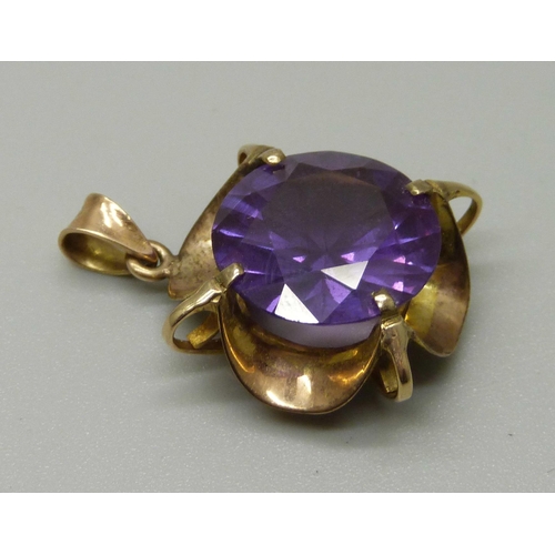 1022 - A 9ct gold, amethyst colour gem set pendant, 5.4g