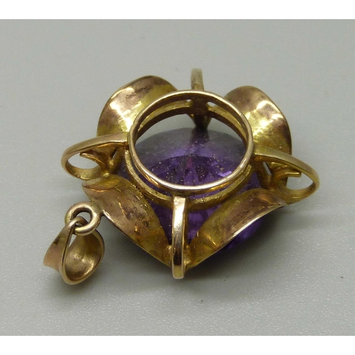 1022 - A 9ct gold, amethyst colour gem set pendant, 5.4g