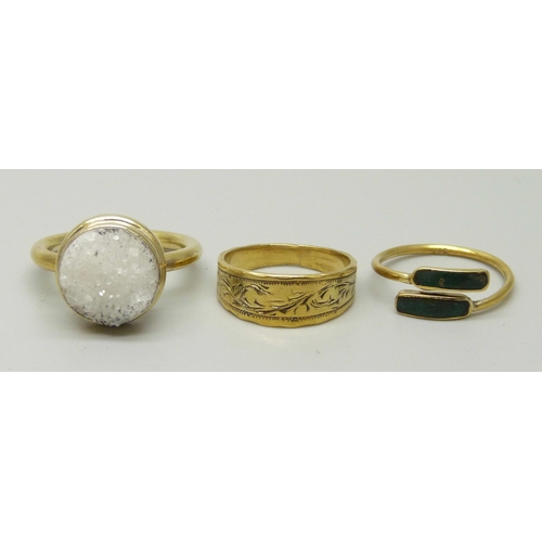 1023 - Three silver gilt rings, K, M and Q