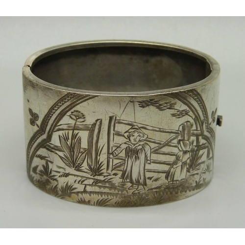 1027 - A c1900 nursery rhyme bangle with hand engraved decoration, 38mm deep, opening 48 x 58mm