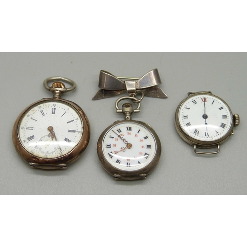 1040 - A silver trench watch, a lady's silver fob watch and a lady's fob watch on a sterling silver bow