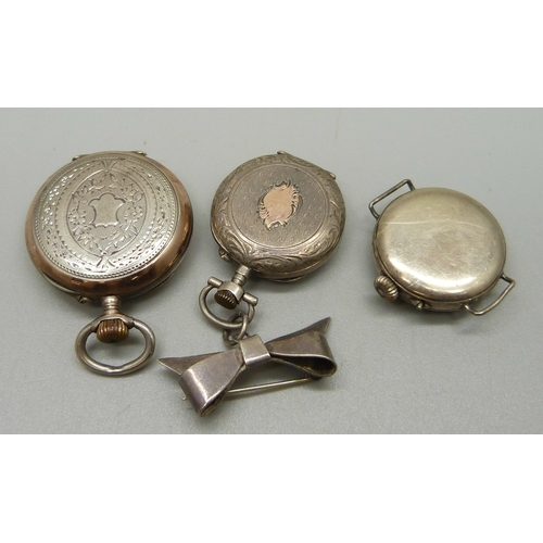 1040 - A silver trench watch, a lady's silver fob watch and a lady's fob watch on a sterling silver bow