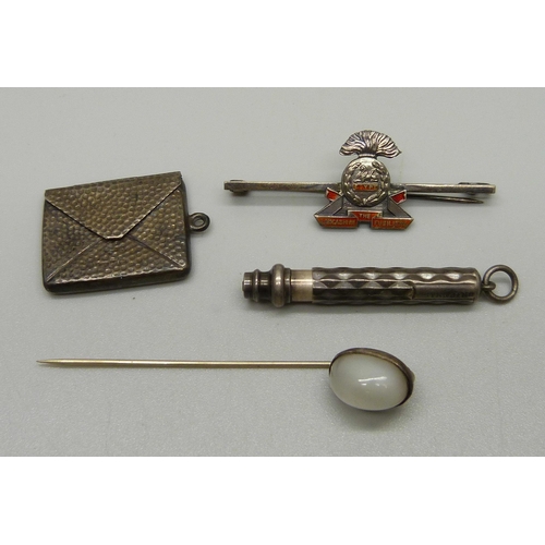 1041 - A silver stamp holder, Chester, a sterling silver and moonstone tie pin, a silver sweetheart brooch ... 