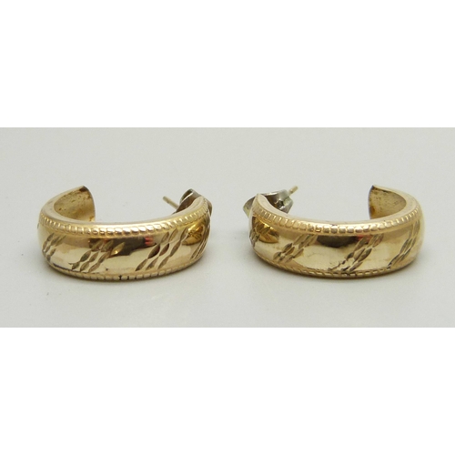 1048 - A pair of 9ct gold hoop earrings, 1.3g