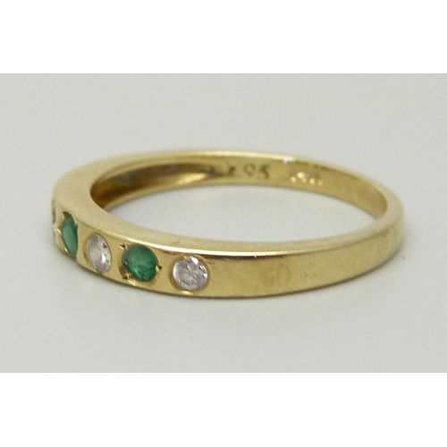 1049 - A 14ct gold, seven stone emerald and zircon ring, marked 14, 2.6g, O