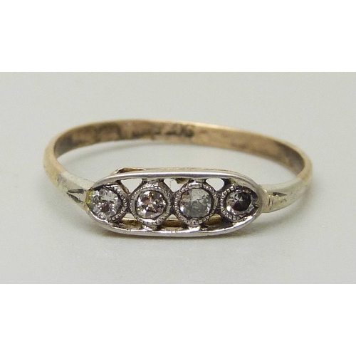 1050 - A 9ct gold and four stone diamond ring, 1.0g, M