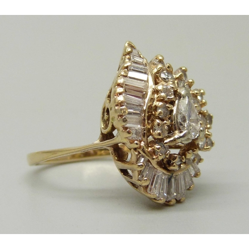 1055 - A 14ct gold, 38 stone diamond ring, circa 1979, over 1 carat of diamonds including unusual pearl sha... 