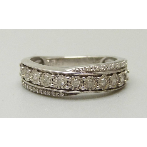 1058 - A 9ct white gold and 37 diamond half eternity ring, 2.6g, K