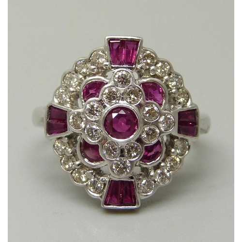 An 18ct gold, 12 ruby and 28 diamond cluster ring, 5.6g, M