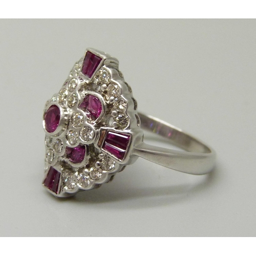 1059 - An 18ct gold, 12 ruby and 28 diamond cluster ring, 5.6g, M