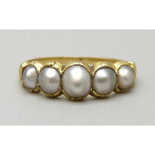 1072 - A yellow metal ring set with five half seed pearls, sizes approximately from 3.6mm to 5.4mm, 2.1g, J