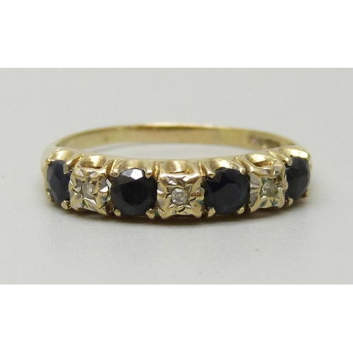 1073 - A 9ct gold half eternity ring set with four sapphires approximately 3.3mm, and three illusion set di... 