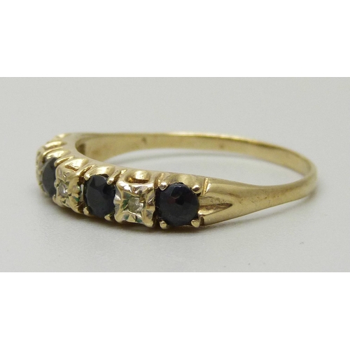 1073 - A 9ct gold half eternity ring set with four sapphires approximately 3.3mm, and three illusion set di... 