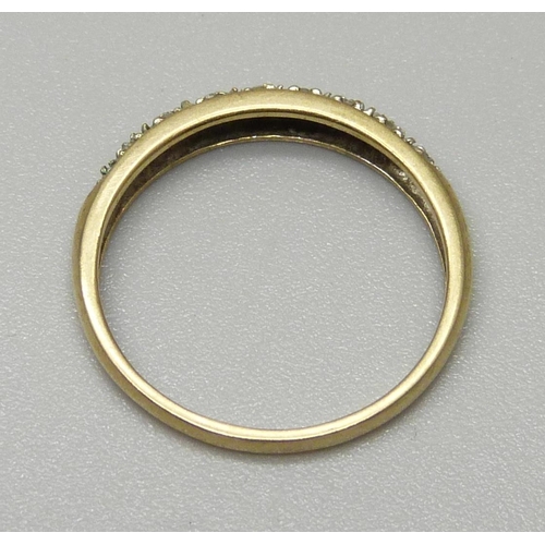 1074 - A 9ct gold ring set with small diamonds, 1.5g, O