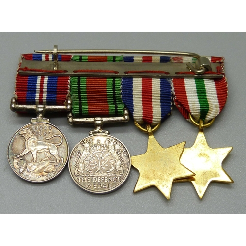 1076 - A set of WWII miniature medals including a Defence medal